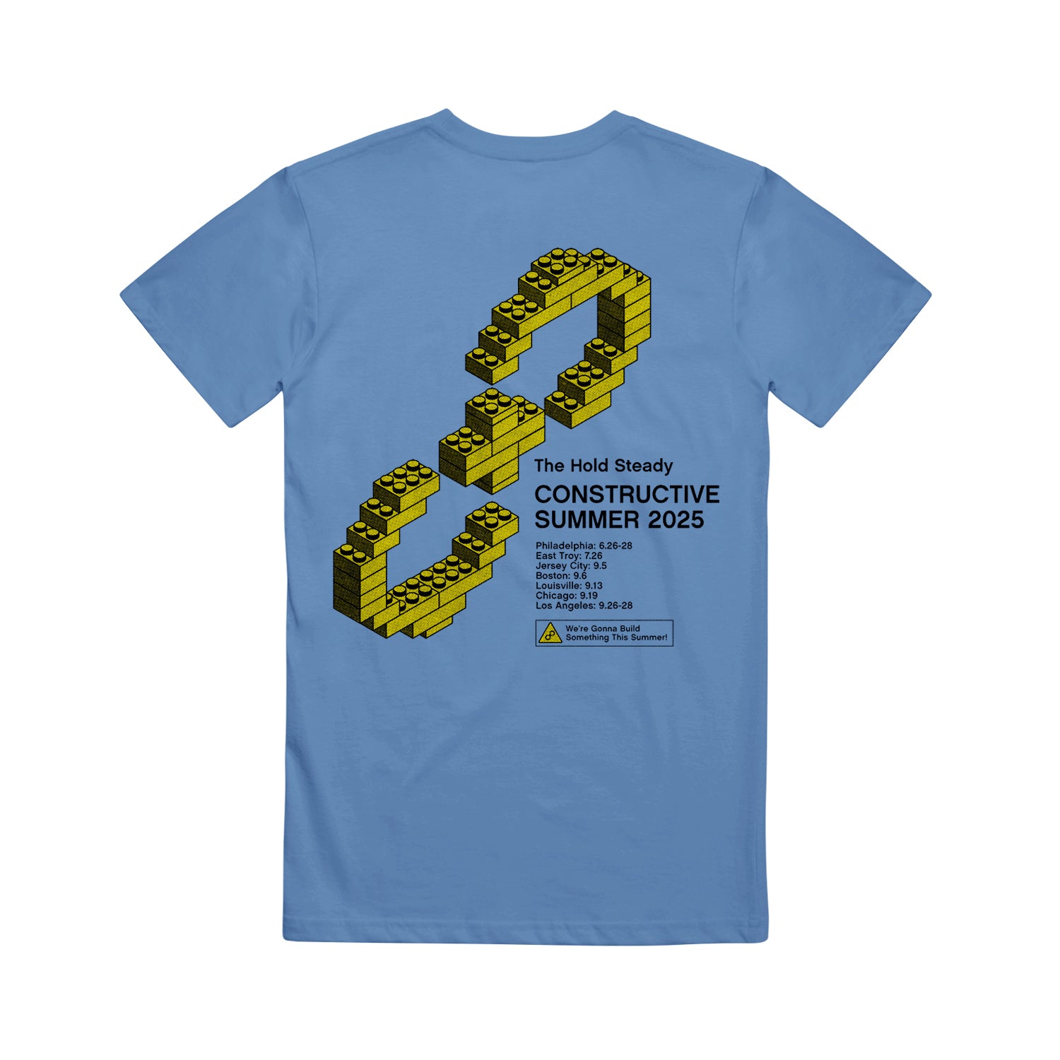 The Hold Steady blue Comfort Colors T-Shirt features a yellow LEGO-inspired infinity symbol and "Constructive Summer 2025" above tour dates—perfect for fans seeking unique, branded concert apparel.