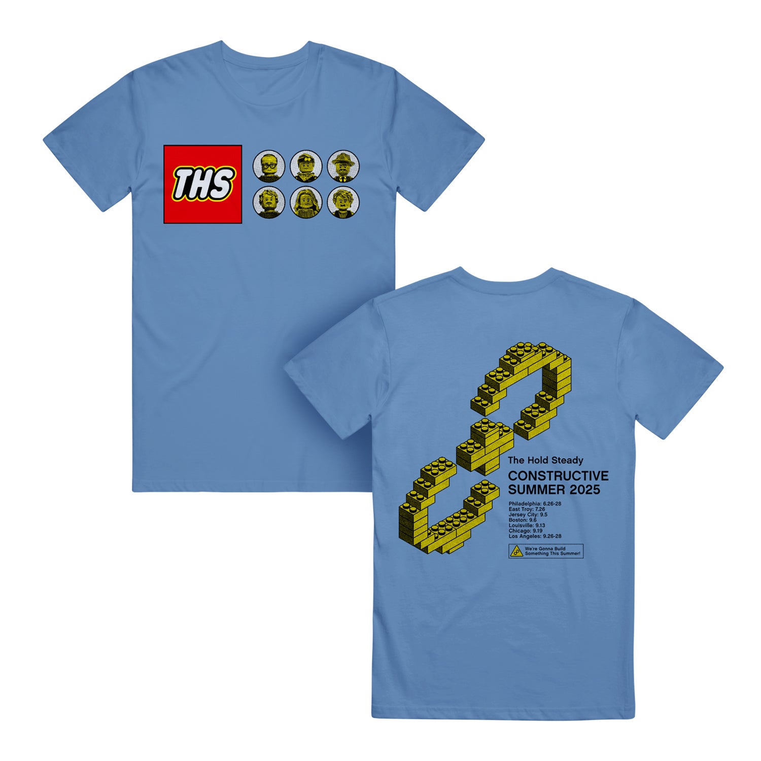 A blue Comfort Colors T-shirt from The Hold Steady with a Lego-style THS logo and six minifigure faces on the front, plus a large Lego infinity symbol and 2025 Constructive Summer event details on the back.